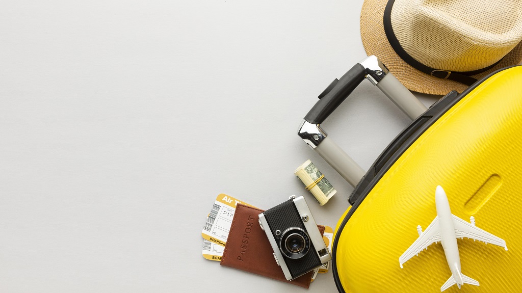 flat-lay-yellow-luggage-with-copy-space 1.jpg
